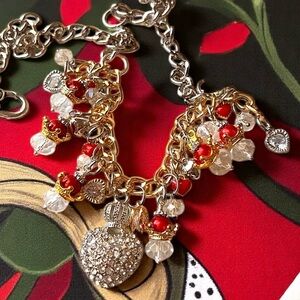 Elegant Gold and Red toned Queen of Hearts Charm Necklace